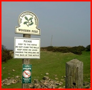 Photograph of the National Trust sign and Wooden Pole
